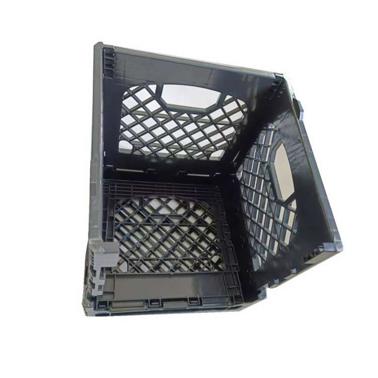 A black milk crate with one side folded.